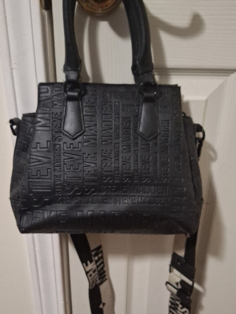 Steve Madden Black Embossed Logo Crossbody Satchel with Branded Guitar Strap - Picture 13 of 14